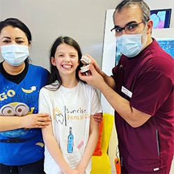 Dr, Mo and Dr. Libi with a patient at Sunrise Dental Clinic Orthodontic & Paediatric Dentistry in Edinburgh, UK